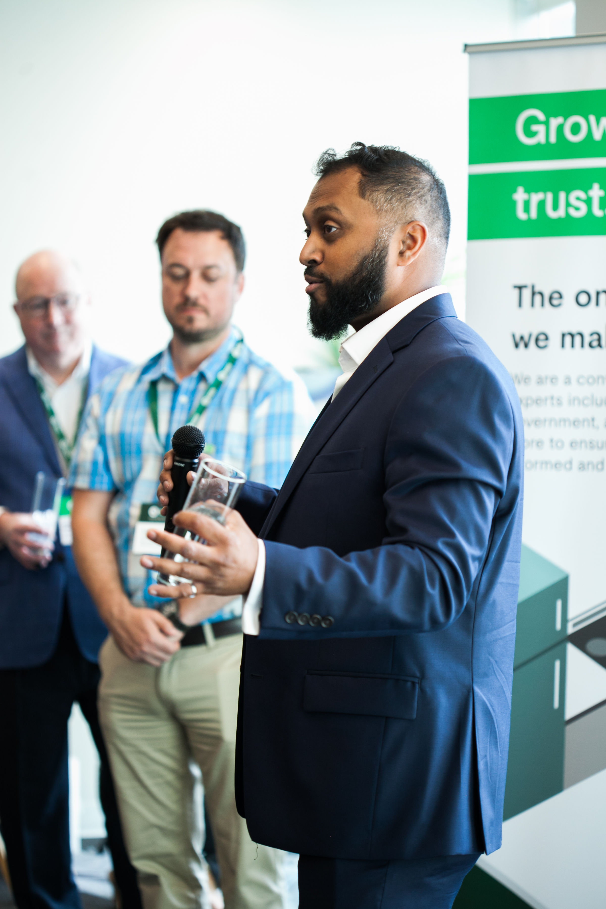 A man speaks to attendees of an event