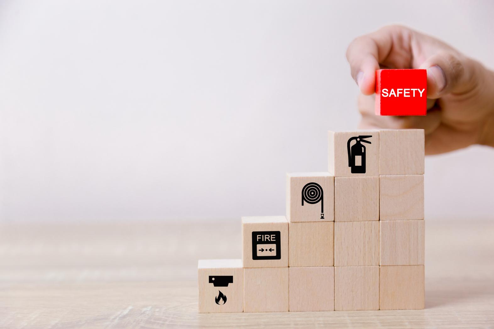 Wooden building blocks imprinted with fire safety iconography