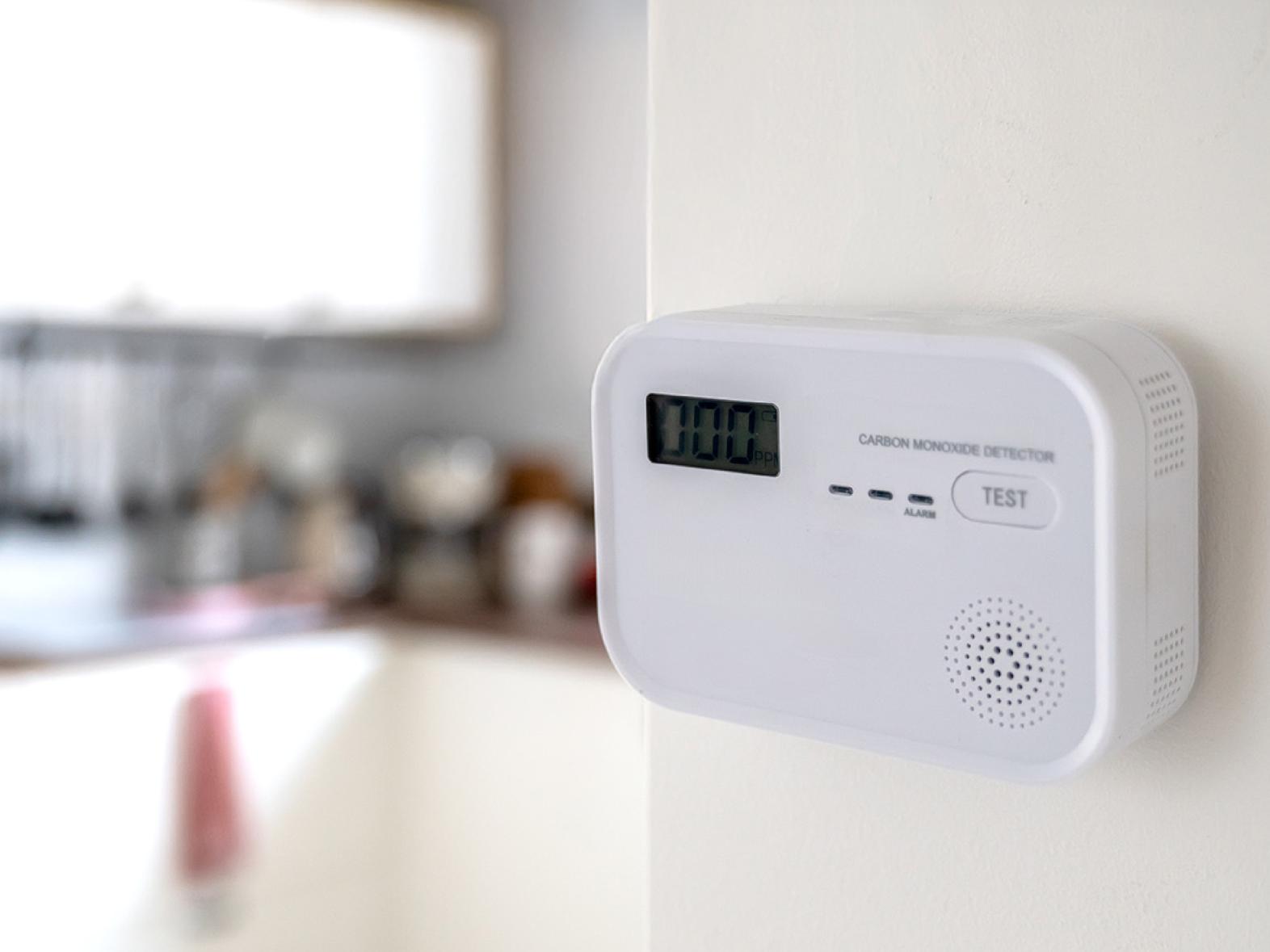 A Carbon Monoxide detector on a wall in a nice house