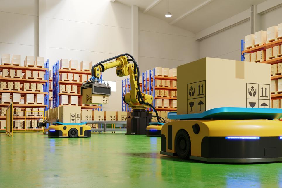 Automated mobile platforms (AMPs) and robotic arms preparing orders for shipping inside an e-commerce fulfillment center packing warehouse