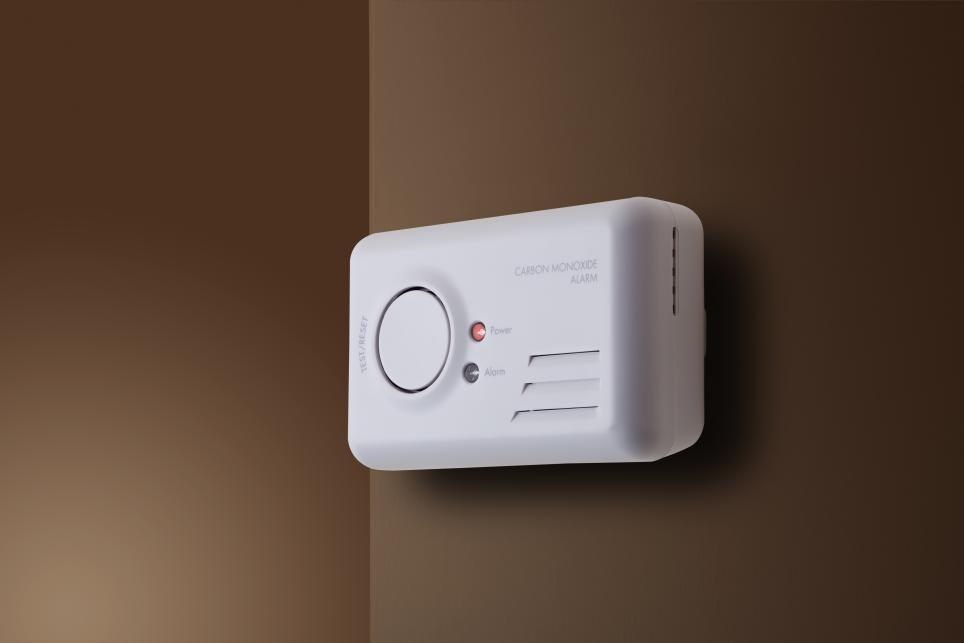 Carbon Monoxide Alarm Mounted on a Wall indoors Monitoring CO levels