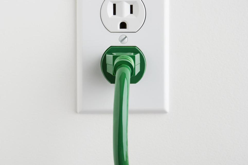 A plug inserted into a household outlet