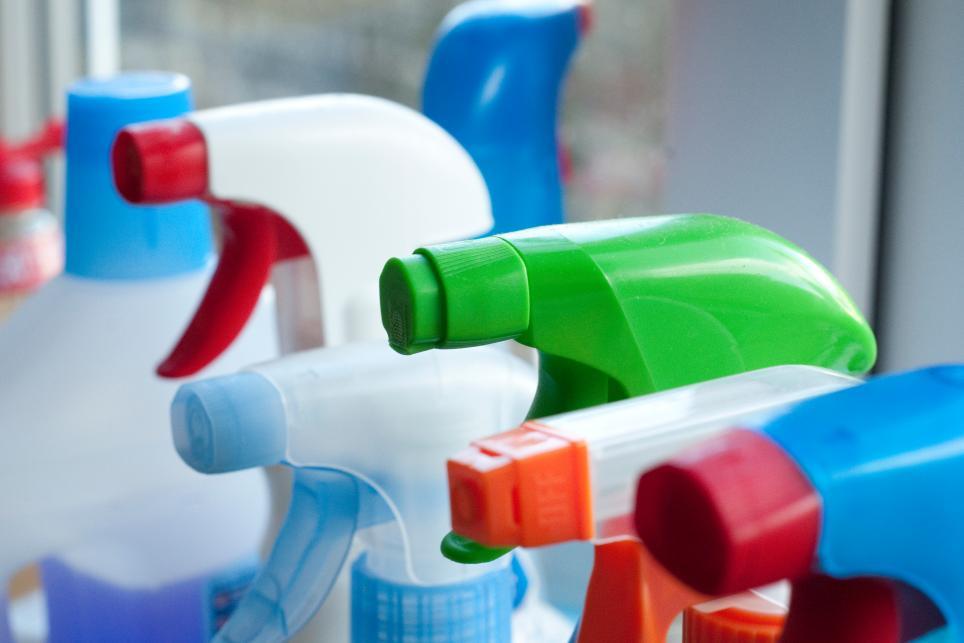 Close-Up Of Spray Bottles In Kitchen