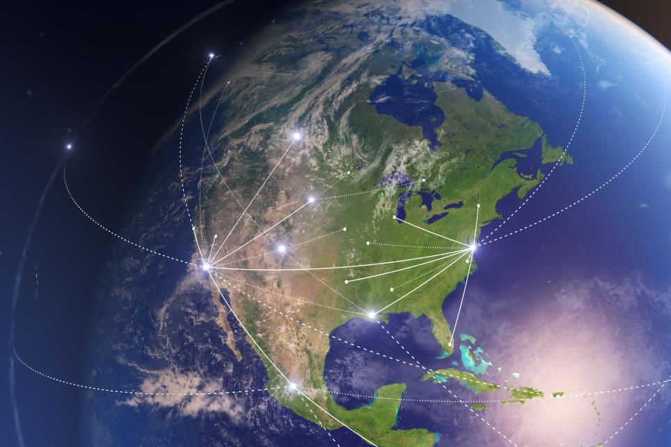 Satellite view of North America including Canada, US and Mexico connected by graphic representation of travel routes 