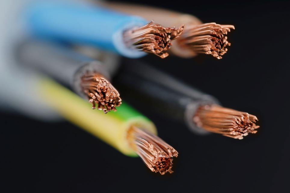 Copper stranded wires and cables with jacketing in various colors - The wires are stripped in preparation for connection to an outlet or switch