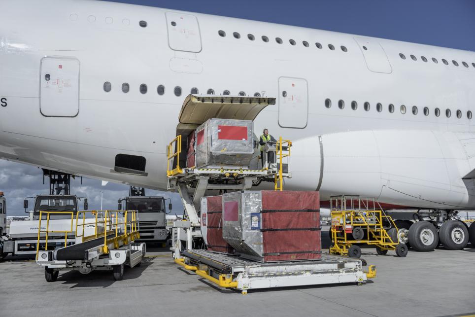 Ground Support Equipment being used to load cargo onto an airplane