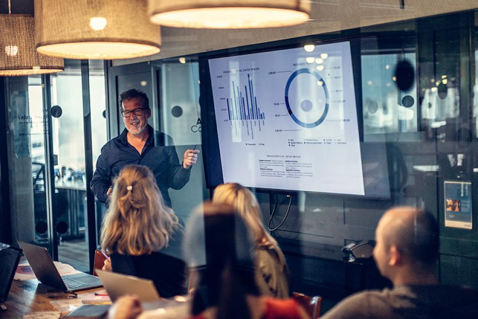 Man presenting on whiteboard