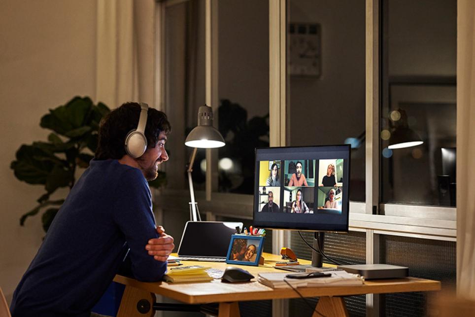 Man wearing headphones at monitor