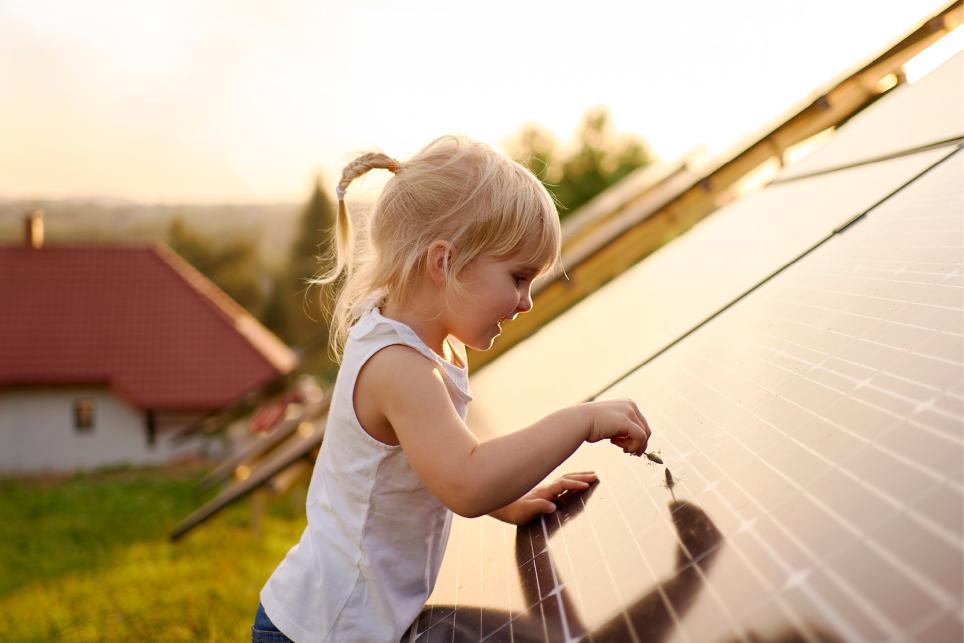 Child playing on solar panel