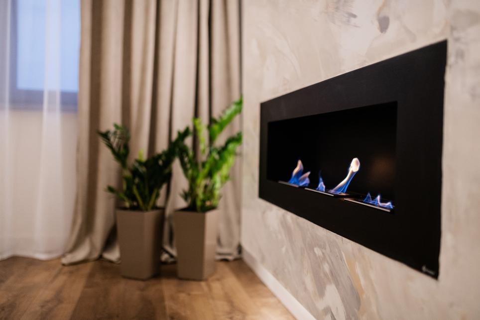 Wall-mounted decorative fireplace.