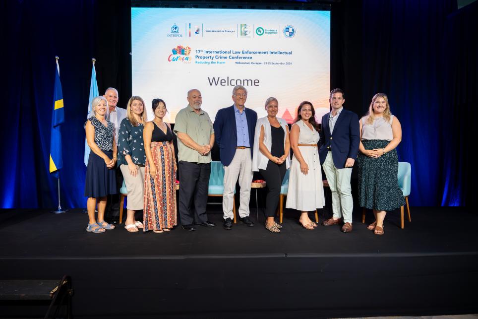 ULSE team members stand onstage for a group photo at the 2024 International Law Enforcement Intellectual Property Crime Conference in Willemstad, Curaçao