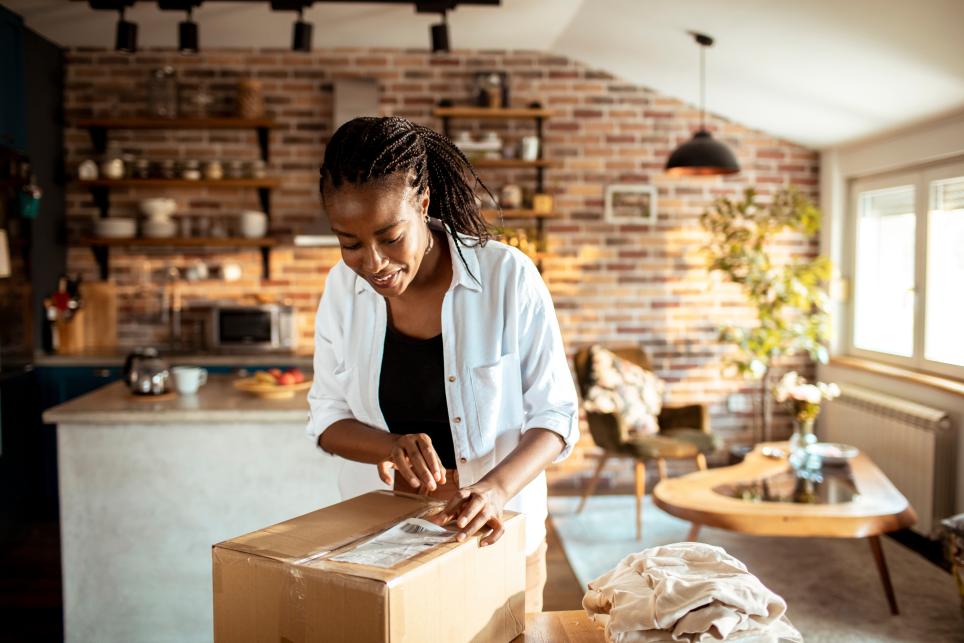 Woman opening a package for something she ordered online