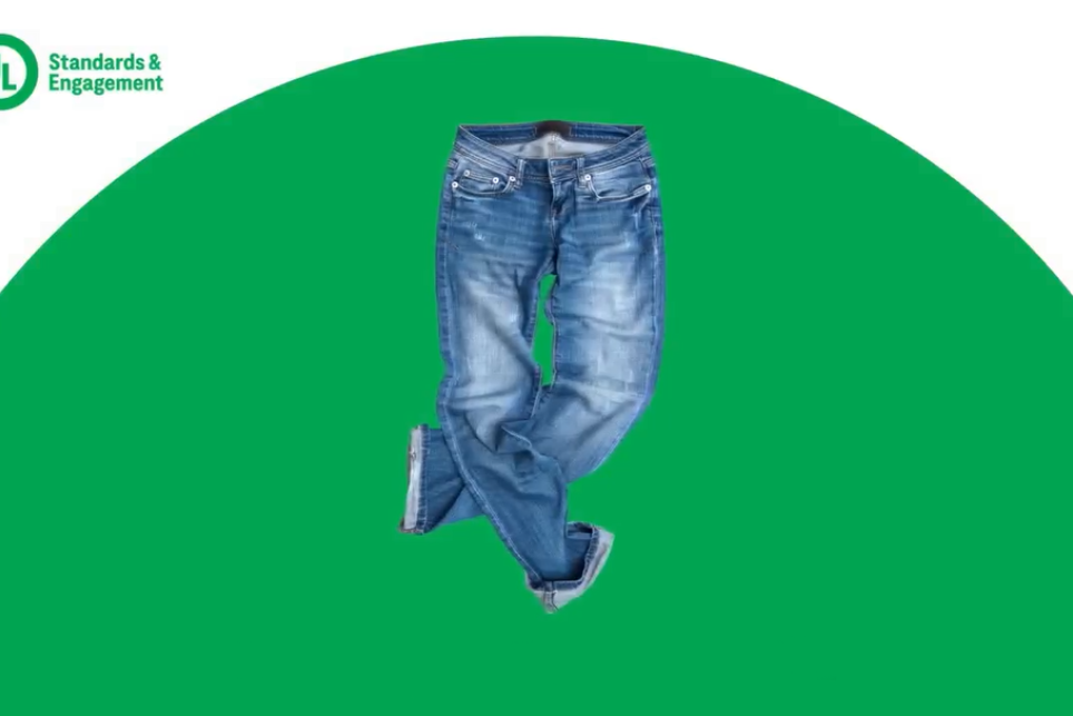 A pair of jeans on a green and white background