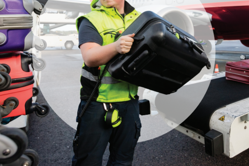 Man loading baggage on a plane