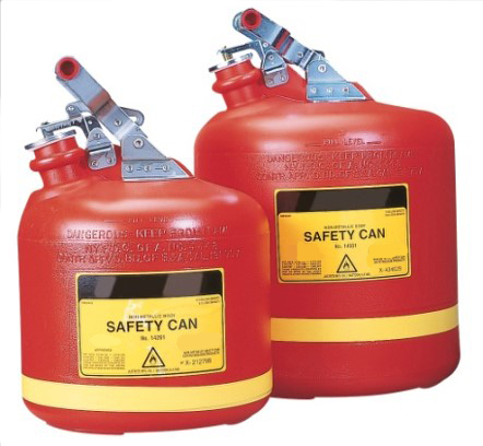 Two red safety cans with yellow labels and silver handles are shown. The cans have warning labels and are used for storing flammable liquids.