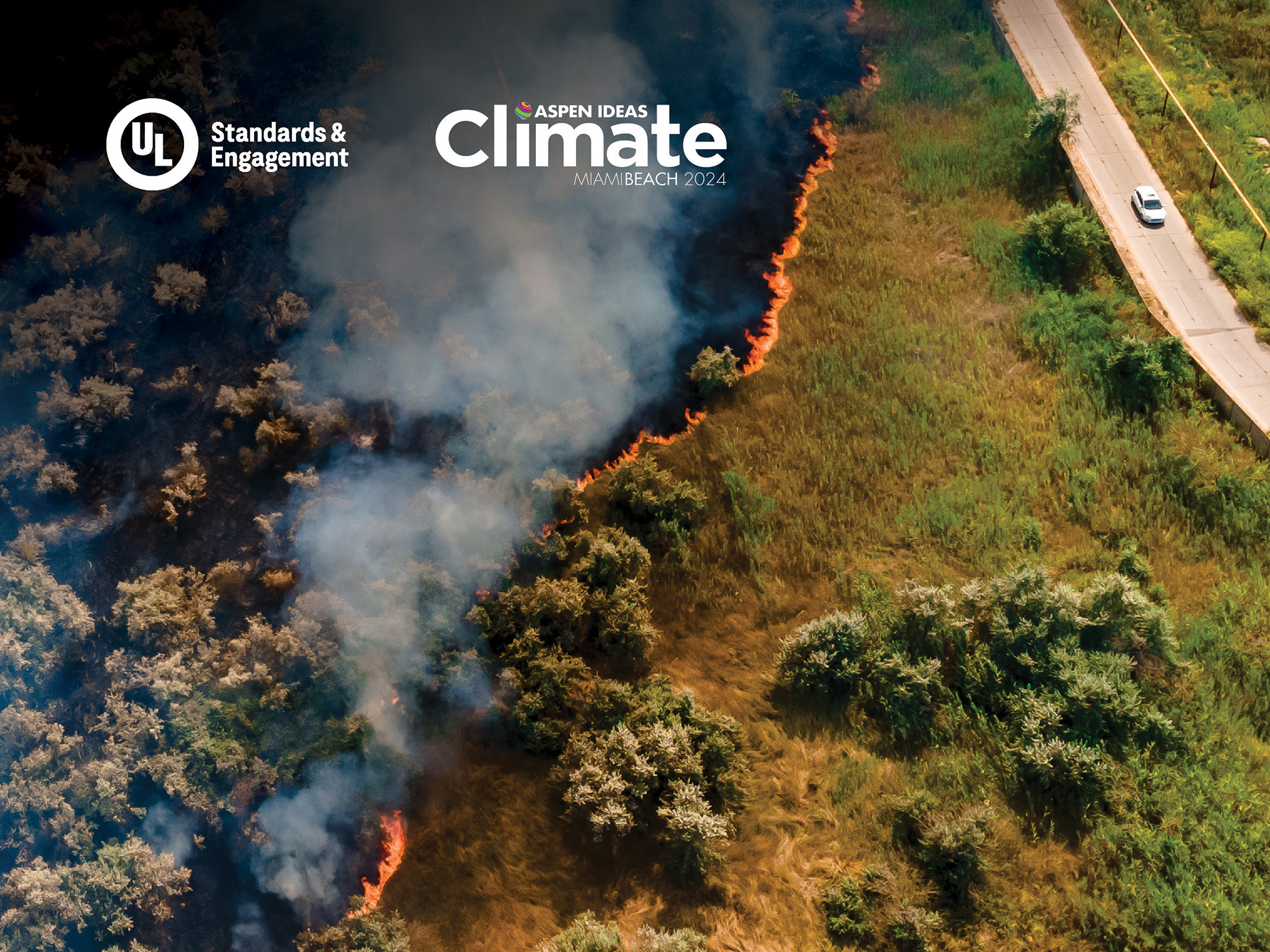 Aerial view of a wildfire burning through grass and bushes near a road with a white car; dark smoke rises as flames spread. "Aspen Ideas: Climate" and UL Standards & Engagement logos appear in the sky area.