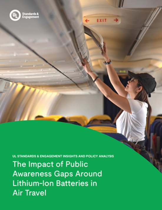 A woman in an airplane cabin lifts her bag into the overhead compartment. The cover text reads, "The Impact of Public Awareness Gaps Around Lithium-Ion Batteries in Air Travel.
