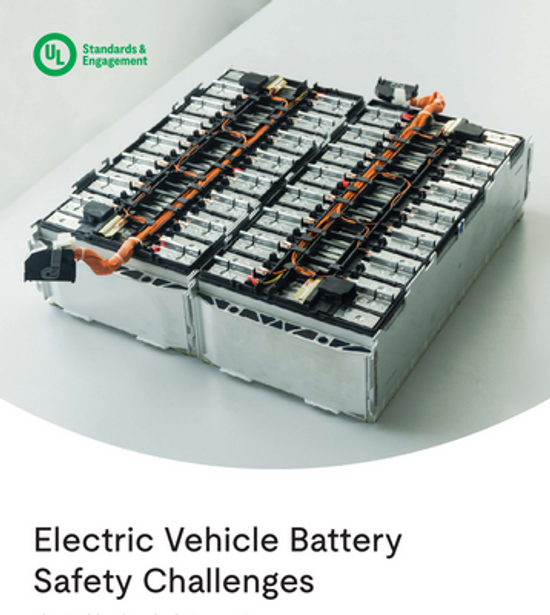A large electric vehicle battery pack with orange cables sits on a white surface. The UL Standards & Engagement logo appears at the top left, with the title "Electric Vehicle Battery Safety Challenges" below.