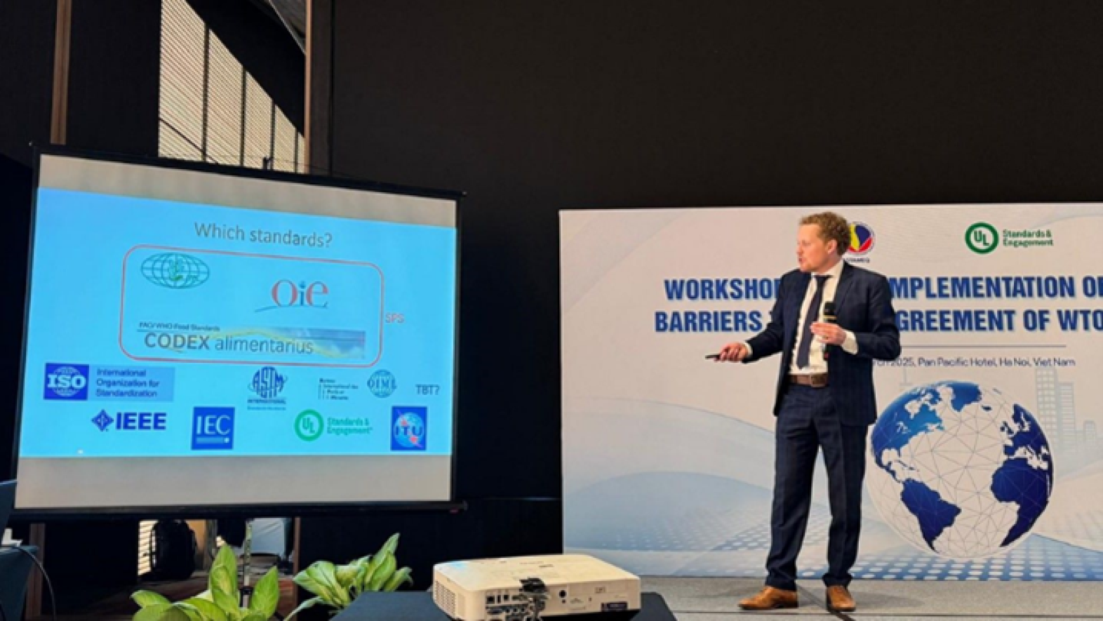 A man presents at the Standards Supporting International Trade and Climate Change Adaptation conference