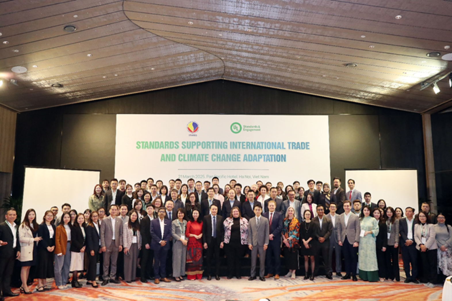 Participants of the Standards Supporting International Trade and Climate Change Adaptation conference join together for a group photo