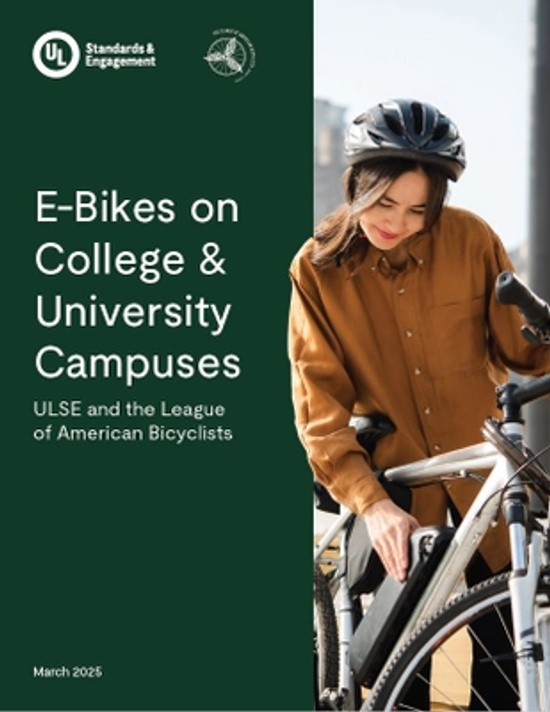 A woman in a brown shirt stands next to an e-bike, wearing a helmet. The cover text reads: "E-Bikes on College & University Campuses. ULSE and the League of American Bicyclists. March 2025.